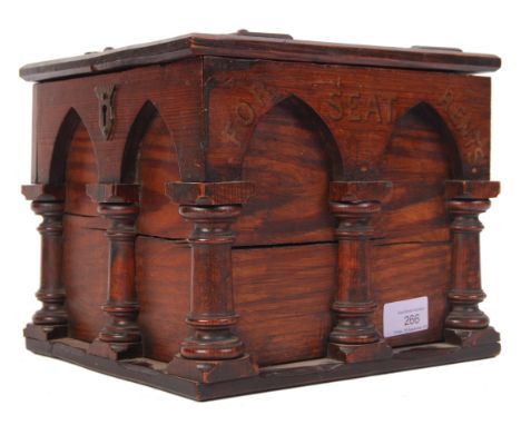 An antique 20th century stained pitch pine ecclesiastical monastery discretion box. The having column and arch design on thre