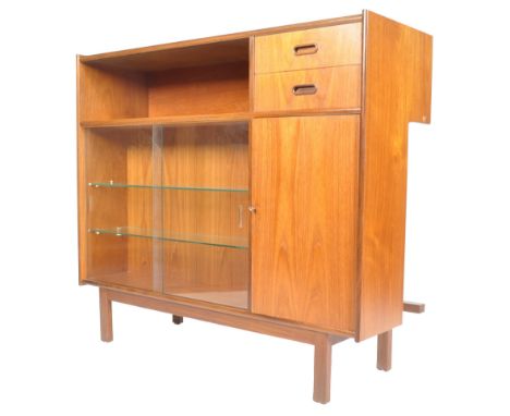 Turnidge Of London - A rare mid century retro vintage teak wood cocktail bar / cabinet having a recess for your legs and a fo