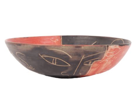 A vintage retro 20th century Italian earthenware ceramic studio pottery bowl. The bowl being glazed in terracotta and black d