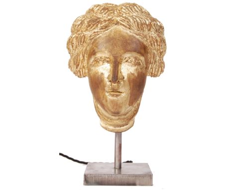 An early 20th century Neo classical Greek style wooden and gilt carving of a lady converted into a table lamp. The carving at