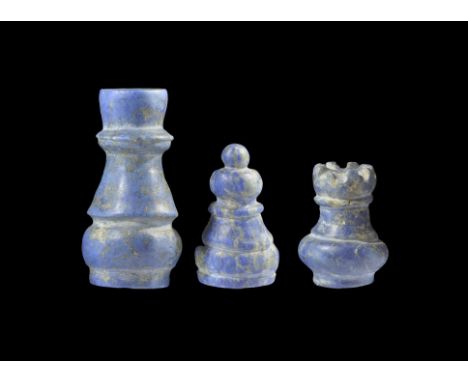 Circa 19th century AD. A group of three lapis lazuli chess pieces - a rook, a bishop and a queen.  102 grams total, 33-54mm (