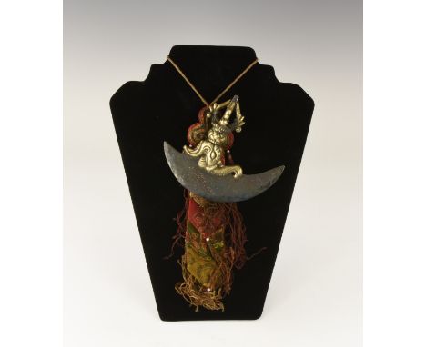 20th century AD. A Tibetan Buddhist kartika, or knife, comprising a brass handle in the shape of a vajra thunderbolt, knotted