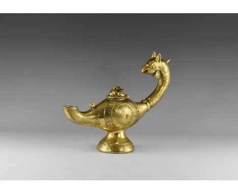 An undated archaistic bronze lamp with domed base, gryphon-head handle, curved spout, hinged lid with mask.  1.6 kg, 29cm (11
