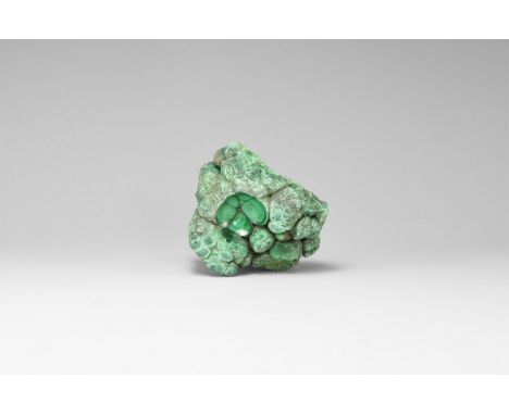 A specimen of botryoidal malachite with a ground-in 'window' to reveal inner structure. See Bonewitz, Dr. Ronald Louis, Rocks