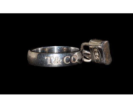 20th century AD. A silver D-section ring inscribed 'T & CO' and '1837' in cartouche to outer face and stamped '©TIFFANY&CO.92