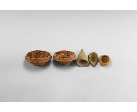 1st century BC-2nd century AD. A group of ceramic items comprising: two bowls with natural deposit, spoon fragment, miniature