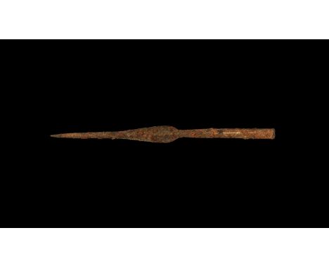 2nd century BC-1st century AD. An iron spearhead with tapering closed socket developing to a thick midrib, leaf-shaped blade,