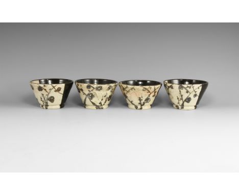 20th century AD. Set of four black Oribe ware glazed ceramic soba cups, with plum blossoms.  490 grams total, diameter: 94mm 