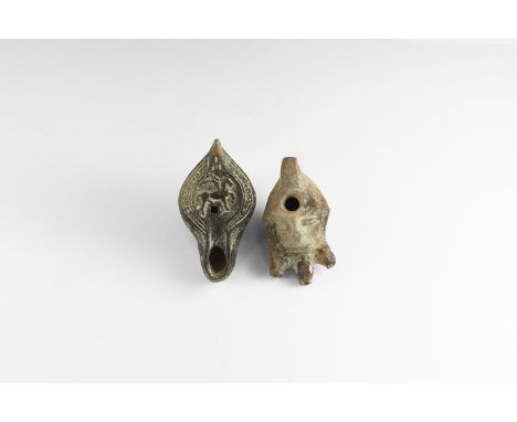 A mixed pair of ceramic oil lamps comprising: a bearded mask with hole to the forehead, three nozzles forming the beard; a sl