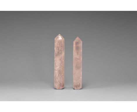 A group of two rose quartz acupressure tools, hexagonal in section, pointed at one end, rounded at the other. See Bonewitz, D