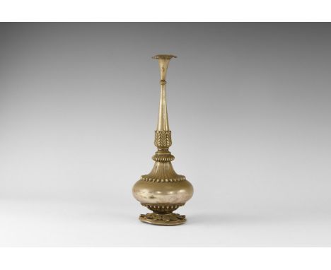 19th-early 20th century AD. An aspergillum with rosetted finial, slender biconvex handle, balustered neck and bulbous body wi