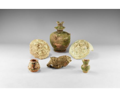 14th-20th century AD. A mixed group of glazed ceramic fragmentary items comprising: an ewer with dense leaf detailing to the 