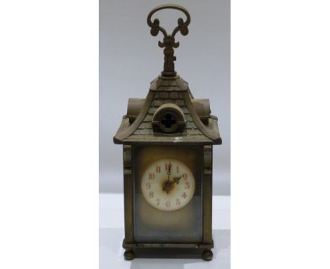 UNUSUAL CARRIAGE CLOCK WITH A CIRCULAR DIAL, PAINTED ARABIC NUMERALS, ENCLOSING A FRENCH EIGHT DAY MOVEMENT STRIKING THE HOUR