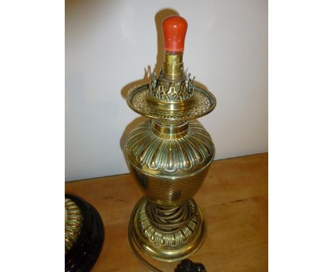 TWO BRASS OIL LAMPS, ONE CONVERTED TO ELECTRICITY WITH GLASS FUNNEL AND BOWL (LARGEST LAMP 64 cm HIGH)