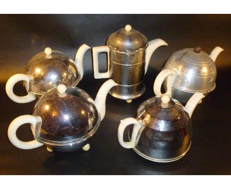 A CERAMIC COFFEE POT AND FOUR TEAPOTS IN CHROME AND ALUMINIUM INSULATED COVERS (5)