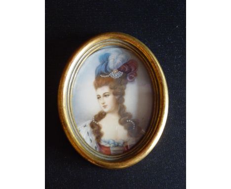 A MINIATURE PORTRAIT OF A WOMAN, SIGNED 'LADE', OVAL (8 cm x 6 cm)