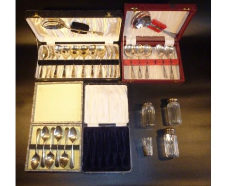 THREE SETS OF PLATED FLATWARE AND A BOX. THREE SILVER TOPPED DRESSING TABLE BOTTLES AND A SHOT GLASS IN A BAROQUE STYLISED SI