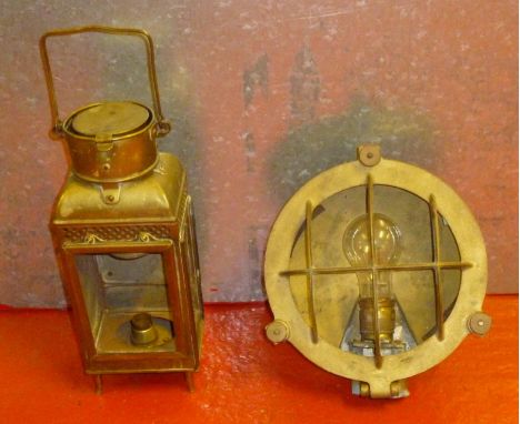 BRASS LANTERN CONVERTED TO ELECTRICITY (h: 33 cm) TOGETHER WITH A SHIP'S WALL LIGHT STYLISED AS A PORTHOLE COVER (d: 24.5 cm)