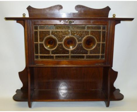 ARTS AND CRAFTS WALL CABINET WITH A CLOLOURED LEAD GLAZED PANELLED FALL DOOR WITH THREE ROUNDELLS AND SHELF BELOW (h: 57.5 cm