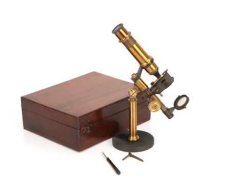 Brass Microscope C.1880, French, unsigned, standing on a lead-filled brass base, supported on a column with compass joint to 