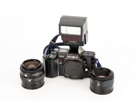 A Minolta 7000 SLR Camera, with AF f/1.7 50mm and AF f/4 35-70mm lenses, complete with Program 2800 AF flash unit (a lot)