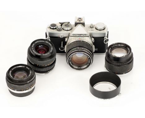 An Olympus OM-1N Film SLR Camera, complete with G.Zuiko f/1.4 50mm, S.Zuiko f/3.5-4.5 35-70mm, Zuiko f/1.8 50mm and E.Zuiko f