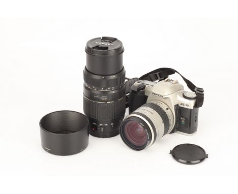 A Pentax MZ-30 SLR Camera, with Pentax-FA f/3.5-5.6 28-80mm lens, together with Canon EF mount Tamron Di f/4-5.6 70-300mm len