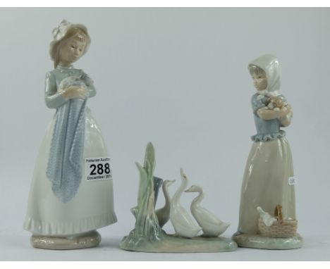 A collection of Nao figures to include a girl holding a puppy, similar figure and a small group of geese (3)