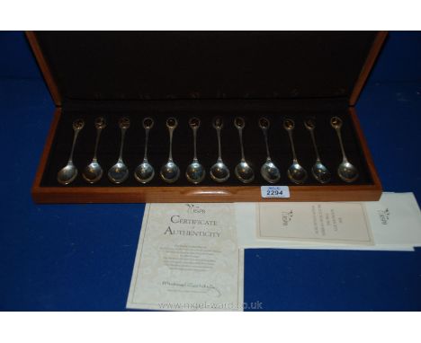 A wooden cased R.S.P.B. Spoon collection, sterling silver with inset with gilt on sterling silver cameo, different bird on ea