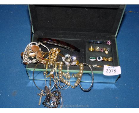 A mirrored jewellery Box with miscellaneous costume earrings, brooches, etc