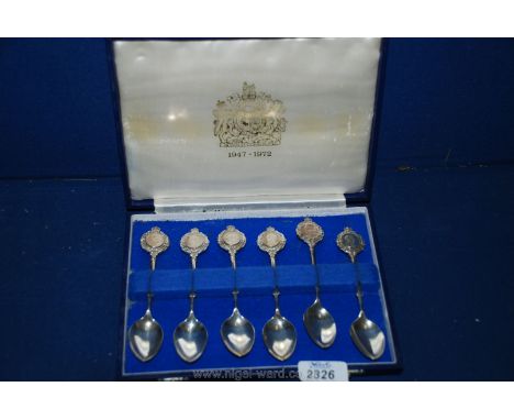 A boxed set of six Silver Teaspoons to commemorate QEII 1947-1972 (Silver Wedding) with images of the Royal family on the spo