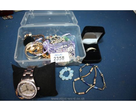 A quantity of jewellery including 925 silver bracelet, ring , 'Lot' toy watch etc and a napkin ring