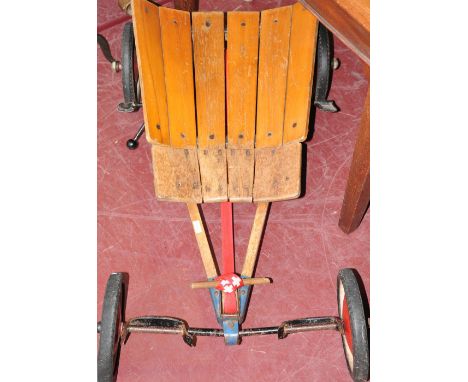 A vintage steiff Ruder Renner wood kart, with foot-operated steering, spring-loaded pulley drive and manual brake