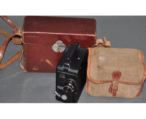 A Vintage Dekko cine camera, with original leather case and instructions, together with a kodak six-20 'Brownie' junior camer