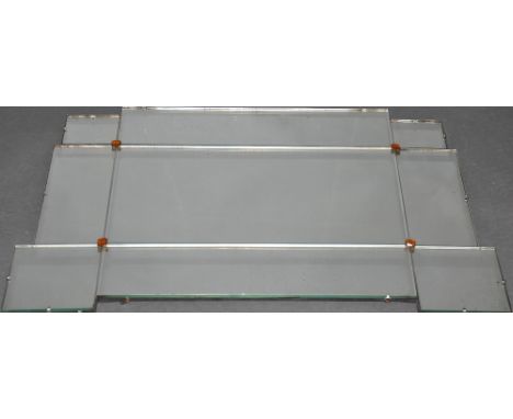 An Art Deco clear and peach glass wall mirror