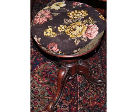 A Victorian mahogany tripod piano stool 