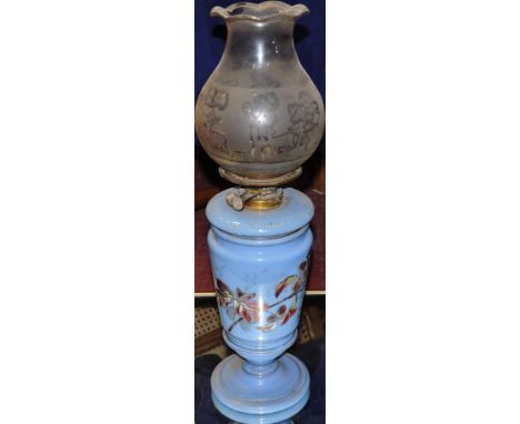 A Victorian blue glass oil lamp painted with a songbird amongst brambles