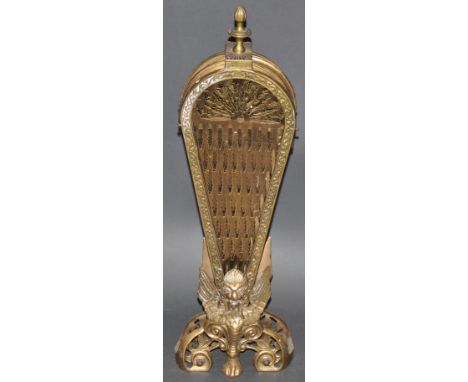 An Empire style pierced brass folding fan shaped fireguard