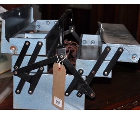 A collection of woodworking tools, some vintage. including a comprehensive set of wood-boring bits, in a metal toolbox