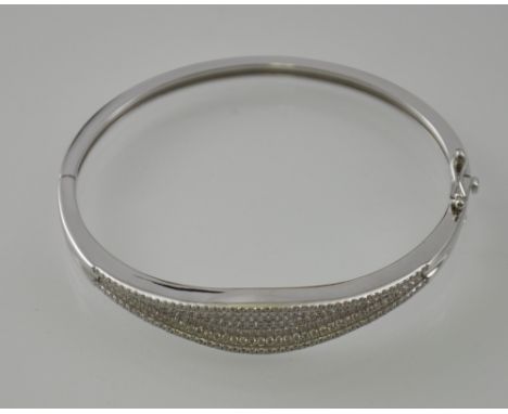 A cubic zirconia and silver bangle