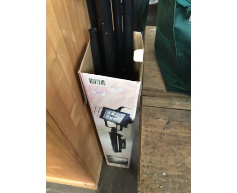 A BOXED WORK LIGHT ON STAND
