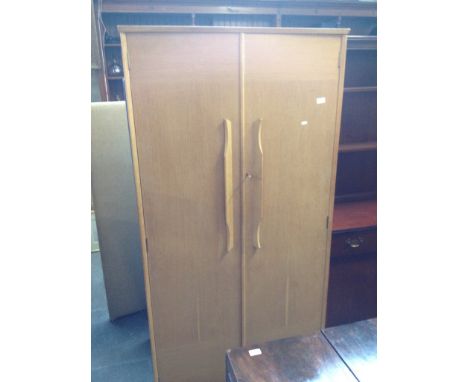 A light oak wardrobe with half fitted interior. W91cm D55cm H183cm.