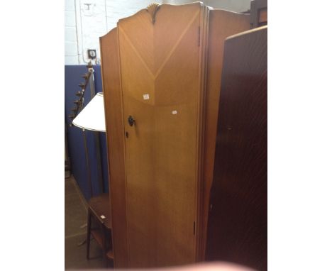 A light oak veneered wardrobe. W92cm D45cm H180cm.