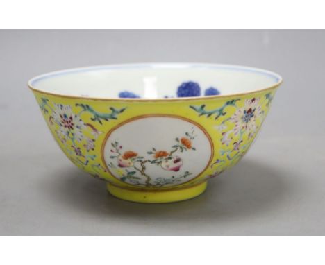 A Chinese yellow ground enamelled bowl, Daoguang mark, diameter 15cmCONDITION: General minor wear to enamels and several ligh