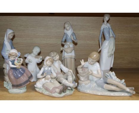 Five Lladro figures, a Nao figure and a Miquel Requena figure, comprising Boy with bird on a tree stump, Girl seated with lil