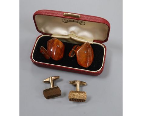 A pair of 9ct gold cufflinks, 6.1 grams and a pair of amber cufflinks.