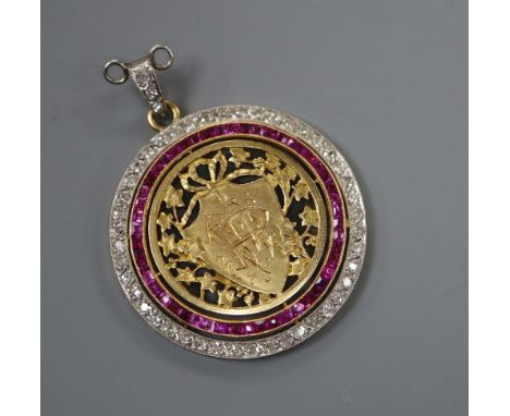 An early 20th century pierced yellow metal, ruby and diamond set circular sweethearts pendant, 30mm gross 8.1 grams, monogram