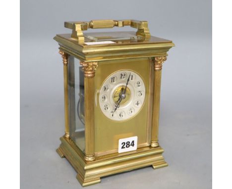 An early 20th century French lacquered brass oversized carriage clock, striking on a gong, movement by Japy Freres four glass