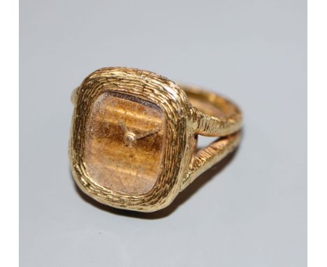 A lady's 1970's? textured 18ct gold Bueche Girod ring watch, size J/K, gross 18.6 grams.CONDITION: Dial has pit spots. Glass 