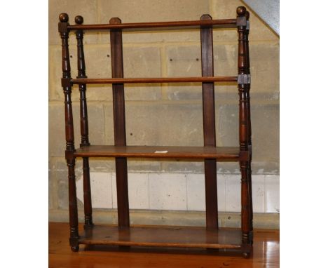 A Victorian mahogany three tier wall shelf with round finials, W.62cm, D.18cm, H.80cm